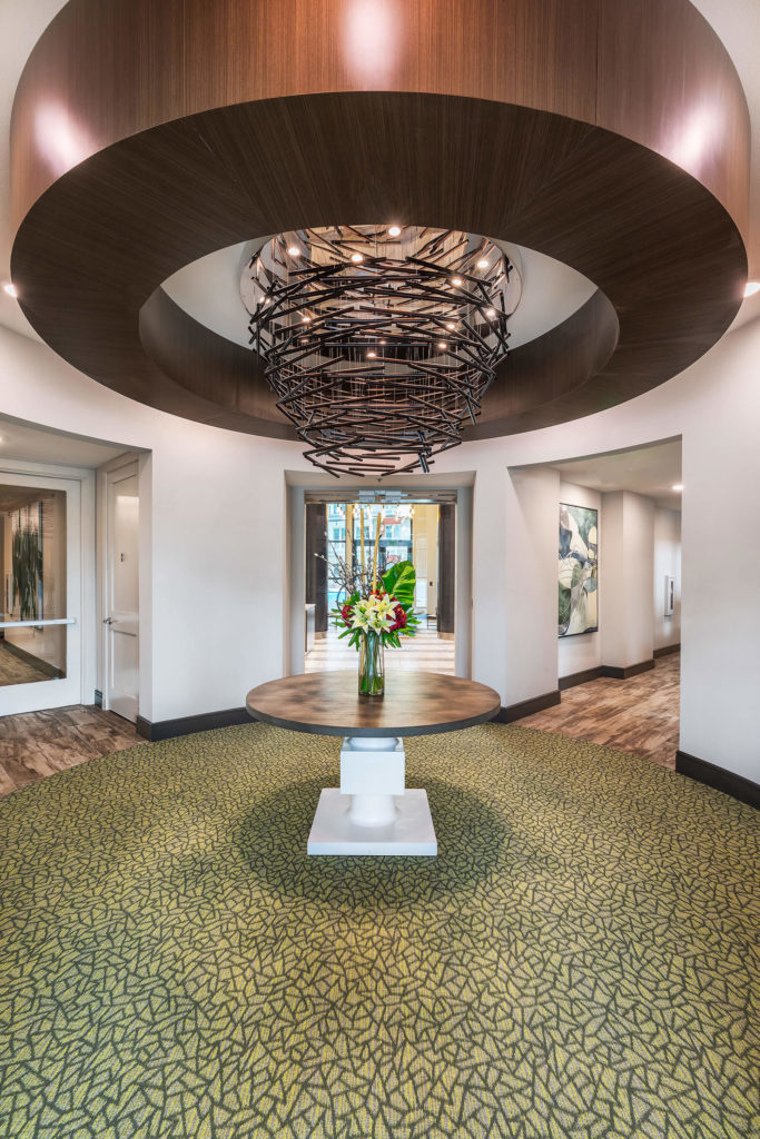 Lobby interior with wooden accents and decorative lighting